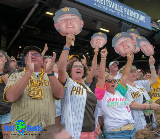 A family enthusiastically cheers for their son during his memorable game, providing support and boosting his confidence.