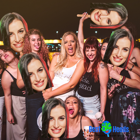 A group of friends celebrating a bachelorette party, smiling and holding a large face cutout of the bride-to-be.