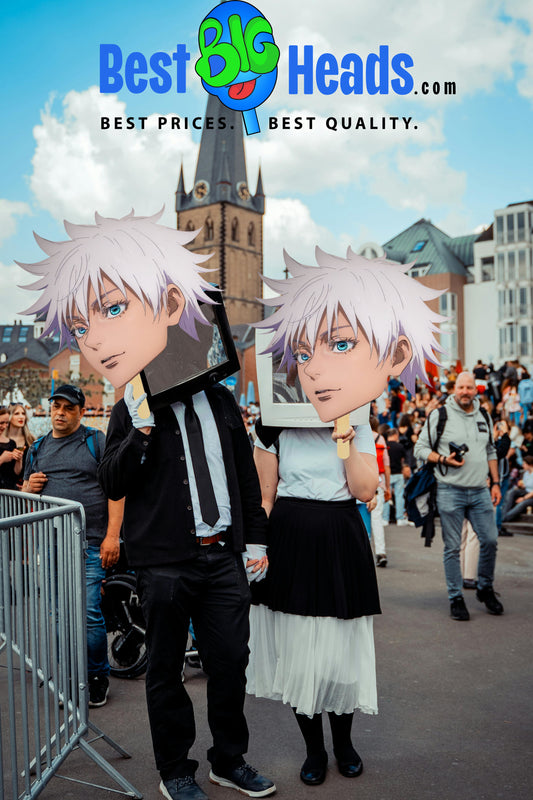 Photo of a couple at a Comic-Con event, each holding a giant face cutout of Satoru Gojo from Jujutsu Kaisen as they pose enthusiastically in front of a lively convention backdrop, showcasing their fandom and support for the iconic anime character.