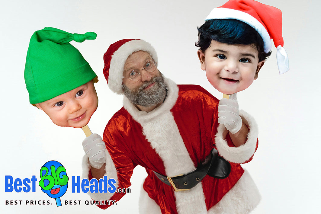 A man dressed as Santa Claus, joyfully holding face cutouts of a cute baby elf and baby Santa, adding a playful and festive touch to the holiday celebration.