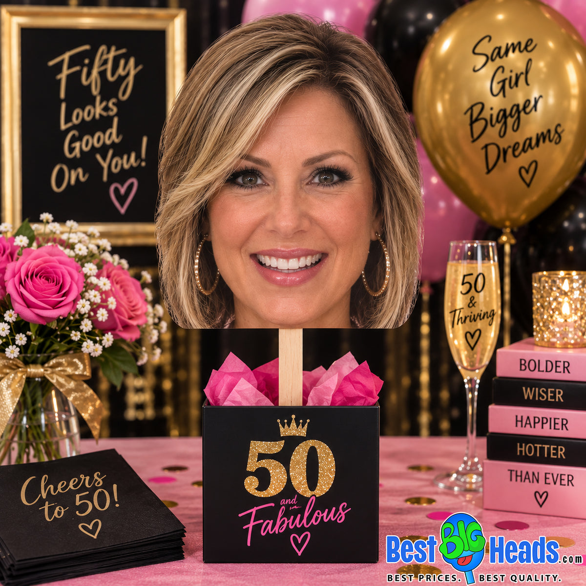 Custom 50th birthday big head cutout with stick displayed at a pink, black and gold 50th birthday party.