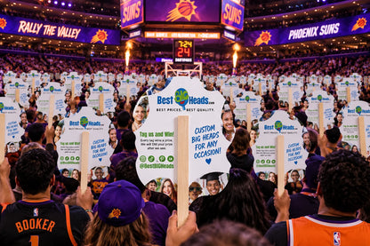 Illustration of Best BIG Heads branded backs held by a basketball crowd.
