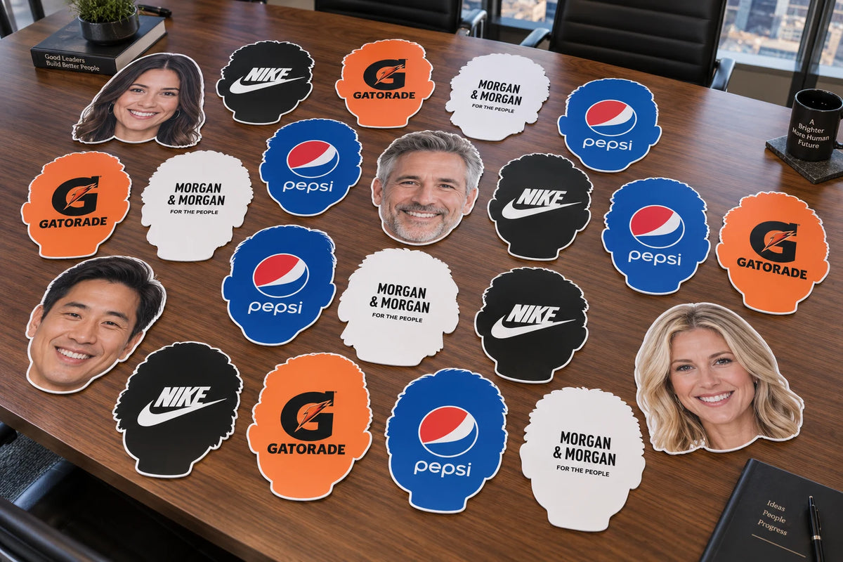 Flat-lay illustration of face cutouts and sponsor-logo backs on a conference table.
