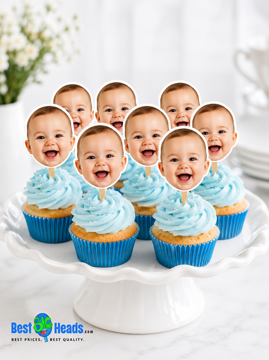 Custom baby face cupcake toppers with smiling baby photo on vanilla cupcakes.