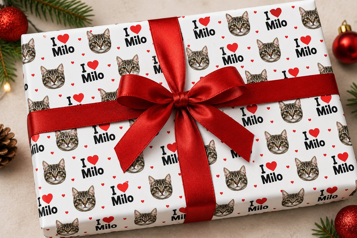 Gift wrapped in white I Heart Name with Face 1 paper with tabby cat faces, I love Milo text and a red ribbon bow.
