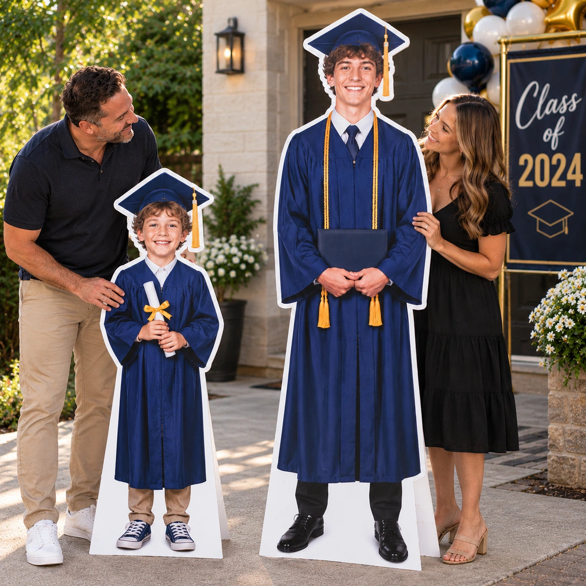 Separate custom standees of a child and a graduate displayed at a graduation celebration with 2024 decorations.