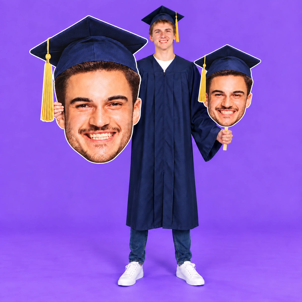 Graduate holding a huge head cutout and matching big head on a stick against a purple background