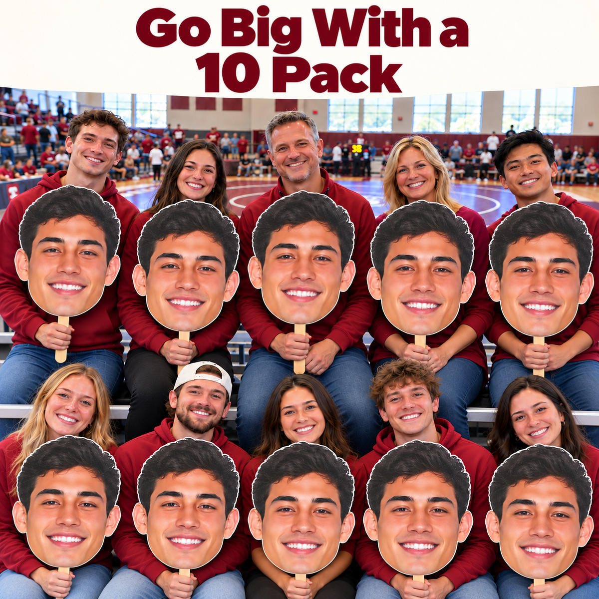 Ten supporters hold matching oversized male face cutouts in gym bleachers beneath the words Go Big With a 10 Pack, with a wrestling mat behind them